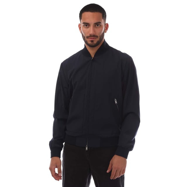 Men's Boss T-Heston-BMB Jacket.- Bomber collar.- Full front branded zip fastening.- Side zip pockets.- Inside zip pocket.- Ribbed cuffs and hem. Material: 67% Virgin Wool, 28% Polyamide, 5% Elastane. Ref: 50468749404.