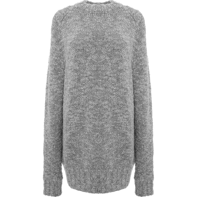 The RAEY Women's Bouclé Raglan Jumper in Grey offers a blend of luxury and comfort. Made from a soft, high-quality mix of 93% merino wool and 7% polyamide, this jumper provides warmth and breathability, making it perfect for cooler days. The bouclé fabric adds a textured, sophisticated finish, while the raglan sleeves offer a relaxed, modern silhouette. The versatile grey color makes it easy to style with a range of outfits, from casual jeans to tailored trousers. Elevate your knitwear collection with this timeless, elegant piece.