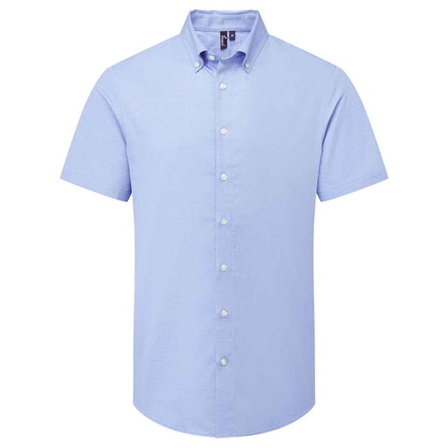 72% Mercerised Cotton, 25% Organic Cotton, 3% Elastane. Fabric: Oxford Cloth, Soft Touch. Design: Plain. Fastening: Button. Neckline: Button-Down. Hem: Curved. Sleeve-Type: Short-Sleeved. Fabric Technology: Stretch. Back Yoke, Pleated Back. 135gsm. Sustainability: Amfori, BSCI, Organic Cotton, Sedex, WRAP Certified.