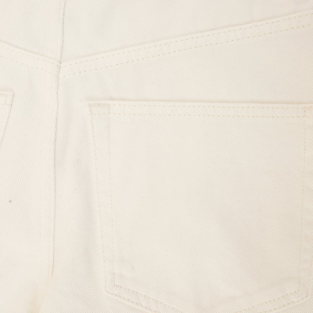 Step into timeless summer style with the RAEY Organic Denim 90s Longline Shorts in White. Made from 100% organic cotton, these shorts are soft, breathable, and eco-friendly, offering both comfort and sustainability. With a nod to '90s fashion, their longline cut provides a flattering, relaxed fit, making them a versatile addition to your warm-weather wardrobe.

The clean white color adds a fresh and crisp touch, perfect for pairing with a variety of tops, from casual tees to stylish blouses. Whether you're heading to the beach or a laid-back brunch, these shorts combine effortlessly with your favorite summer staples for an effortlessly chic look.

Key Features:

Crafted from 100% organic cotton for a soft, sustainable feel

Longline cut for a relaxed, flattering fit

Crisp white color for a fresh, versatile look

Ideal for pairing with casual or dressy summer outfits

Eco-friendly design for the conscious consumer

Chic, comfortable, and sustainable, these 90s-inspired longline shorts are the perfect piece for a stylish, eco-conscious summer.
