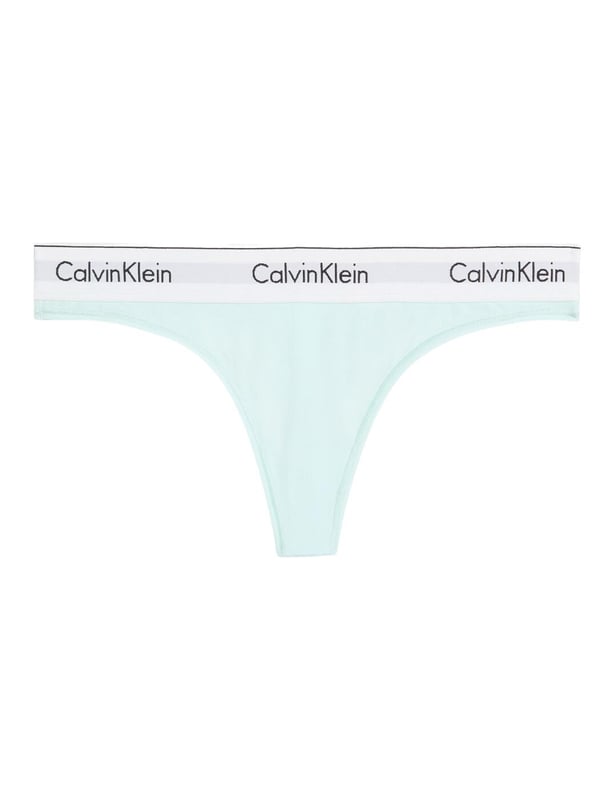 Calvin Klein Modern Cotton Thong Ladies, say goodbye to uncomfortable and unflattering lingerie and hello to the Calvin Klein Modern Cotton thong. Its low-rise fit and minimal rear coverage make it discreet yet fashionably versatile, ideal for any look or occasion. Crafted from a breathable cotton blend, this thong promises day-long comfort, blending seamlessly under any outfit with its sleek, opaque design. Adorned with the iconic Calvin Klein logo waistband, it assures a luxe feel while ensuring a perfect fit. Ideal for complementing with other pieces from Calvin Klein's lingerie line, it's a must-have for those prioritising comfort without compromising on style. Elevate your lingerie collection with this essential piece – your go-to for confidence and elegance every day.