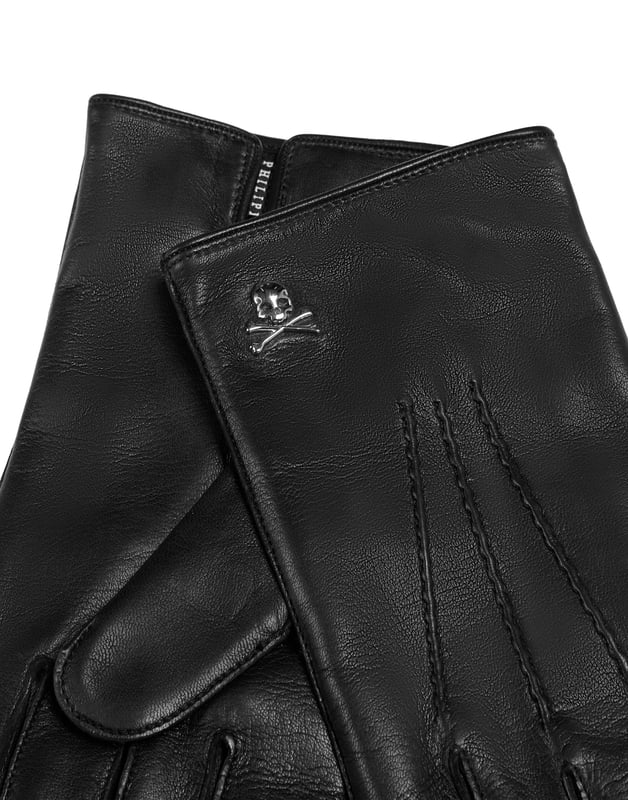 Details maken het verschil. Ontdek de zachtheid van deze nappa handschoenen met de iconische Skull&Bones op een stud. Voering van puur kasjmier.