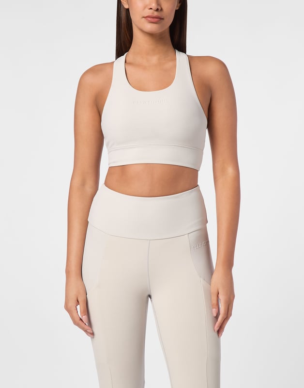 Comfortable and light-weight top designed to help you push your limits.   Maximum comfort and quick dry Lycra®   Triple crisscross straps   Support especially designed for cycling or gym training   Bottom hem grants support and firmness