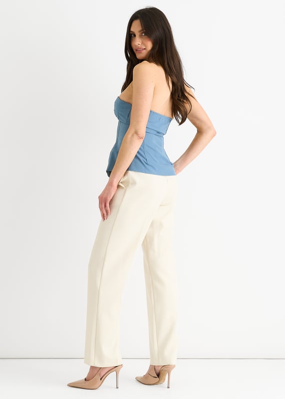 Upgrade your summer wardrobe with our Blue Seam Detail Bandeau Zip Front Top. Its bold blue color and unique zip front design make this top a standout piece. The seam detailing adds a touch of texture and elevates the look. Perfect for any occasion, this top is sure to make you feel confident and stylish.