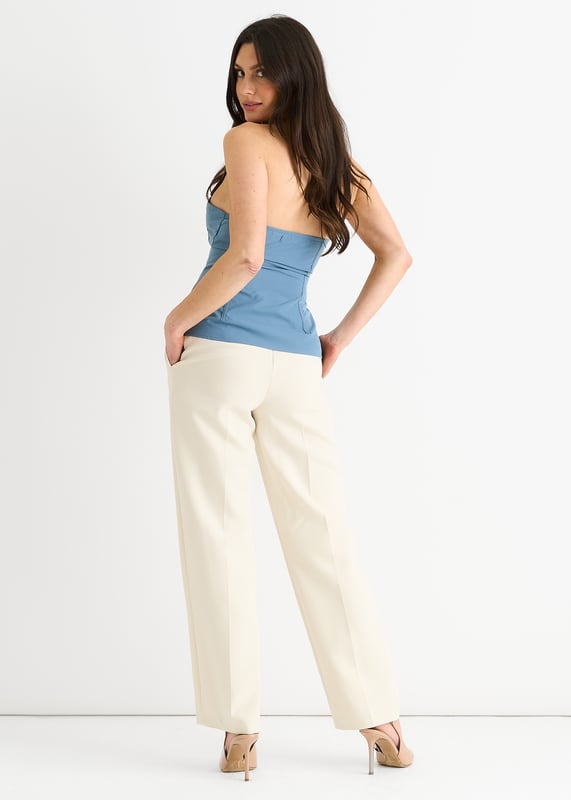 Upgrade your summer wardrobe with our Blue Seam Detail Bandeau Zip Front Top. Its bold blue color and unique zip front design make this top a standout piece. The seam detailing adds a touch of texture and elevates the look. Perfect for any occasion, this top is sure to make you feel confident and stylish.