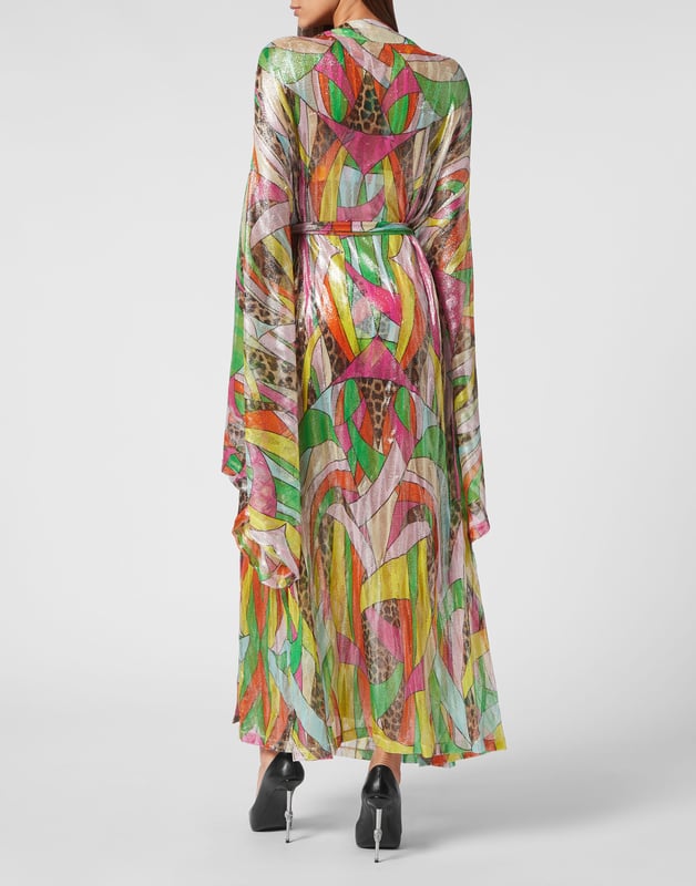 Déjese conquistar por este look Diva: lo hemos diseñado para dar color a su verano. Descubra cómo llevar la nueva versión de un caftán envolvente.   Punto de viscosa de lúrex con estampado de parches multicolor.   Parte delantera anudada   Mangas anchas tipo kimono   Pespunte a dos agujas