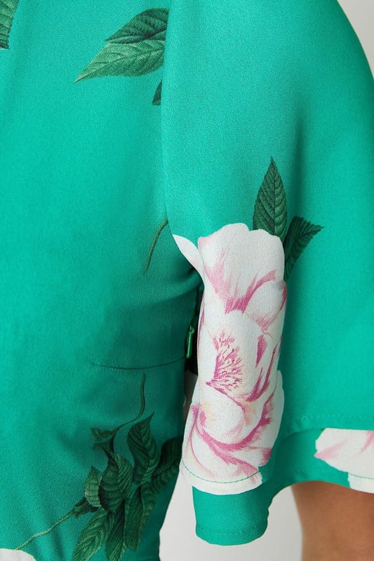 Vibrant floral print adorns this woven midi dress
Flattering round neckline and flutter sleeves
Relaxed fit through the bodice
Midi length hits below the knee
woven fabric with a lightweight feel

Embrace the season's botanical trend with this eye-catching floral midi dress. The vibrant print and flutter sleeves exude a feminine charm, perfect for daytime occasions like brunches or family gatherings. Style it with trainers or sandals for a relaxed yet polished look that transitions seamlessly from day to night.