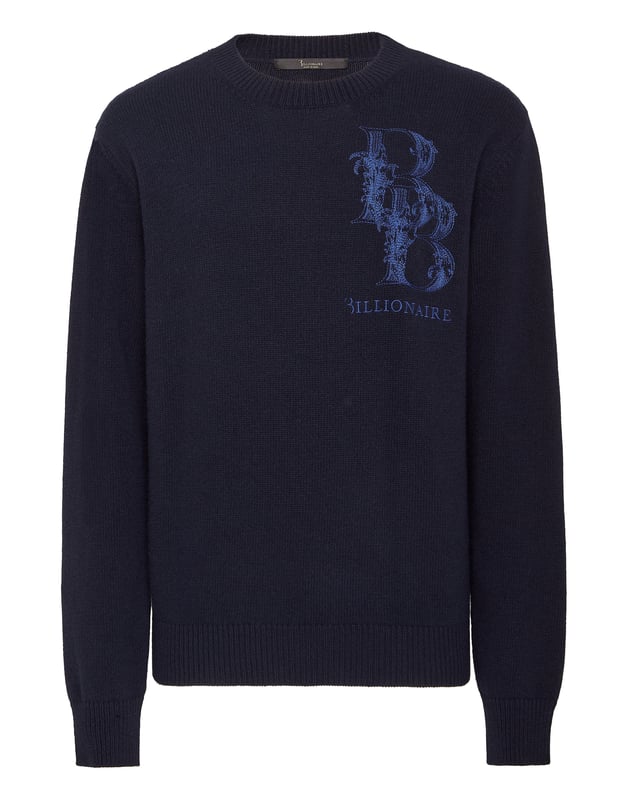Explore nuevas formas de expresar la elegancia con las sugerencias de esta temporada. Le recomendamos este jersey de punto de lana con cuello redondo. Fíjese en los detalles.  Lana merino de punto liso de galga 8/10  Monograma icónico de la marca bordado en el pecho izquierdo  Escudo metálico cosido en el canesú  Dobladillo de punto elástico