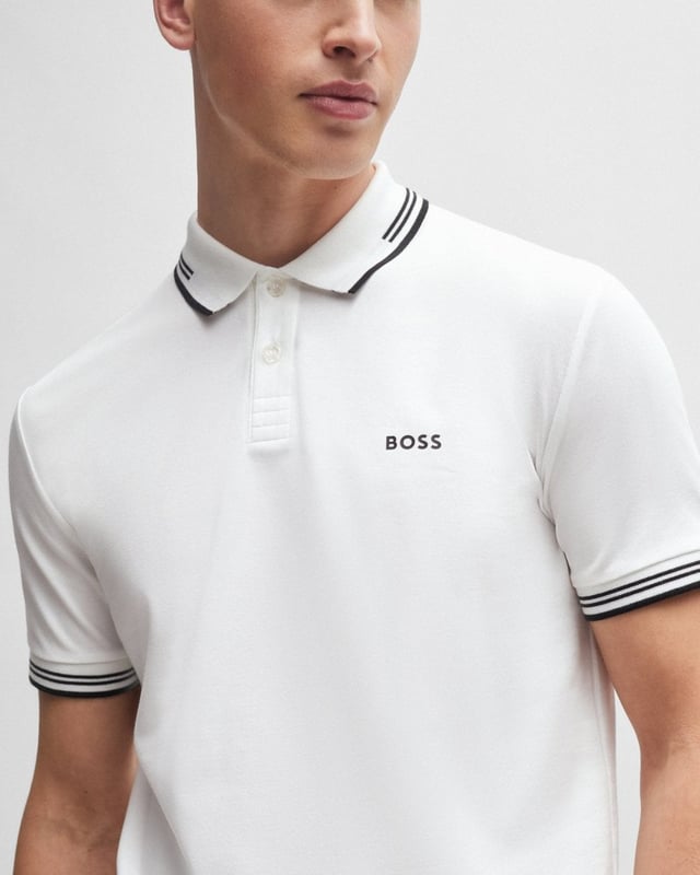 A contemporary polo shirt cut to a defined fit by BOSS Menswear, created in stretch cotton with contrast stripes and branding.

Slim fit
Flat-knit collar
Number of buttons: 2
Short sleeves
Flat-knit cuffs
Standard length
92% Cotton, 8% Elastane

50506193