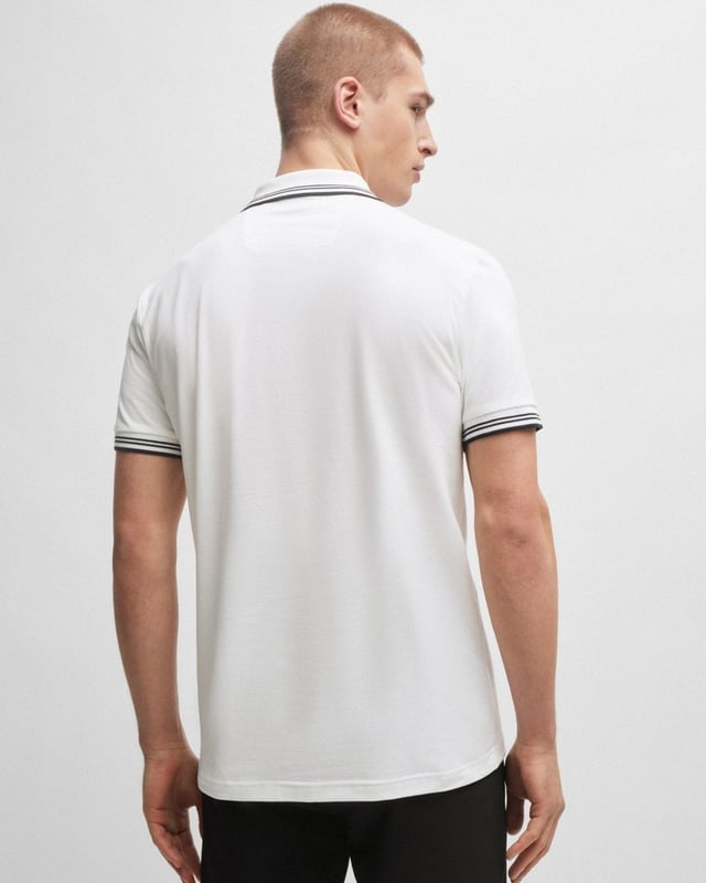 A contemporary polo shirt cut to a defined fit by BOSS Menswear, created in stretch cotton with contrast stripes and branding.

Slim fit
Flat-knit collar
Number of buttons: 2
Short sleeves
Flat-knit cuffs
Standard length
92% Cotton, 8% Elastane

50506193