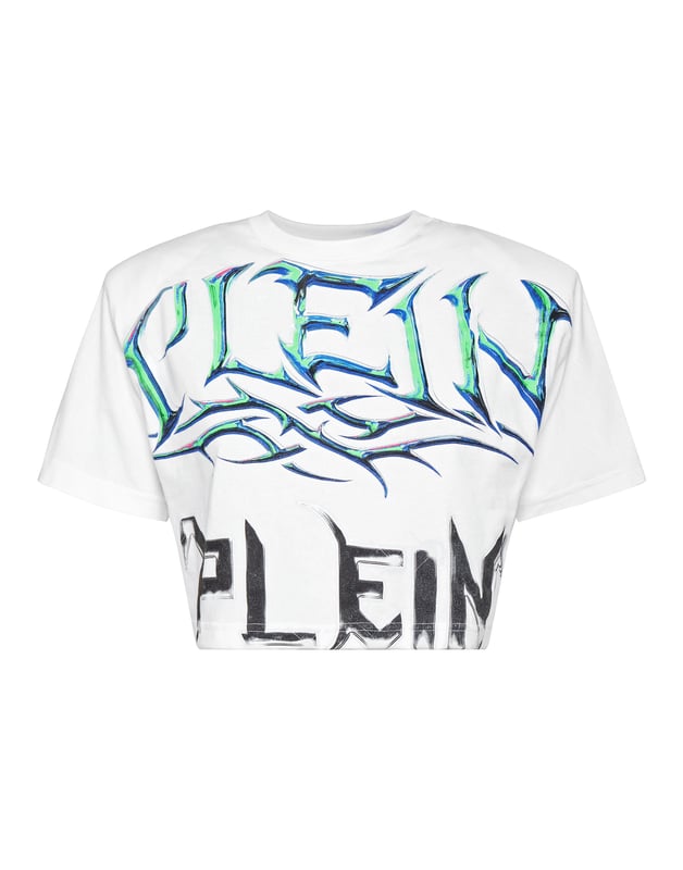Añade una pizca de singularidad a tus conjuntos con esta camiseta crop de algodón. Fíjese en los detalles.   Punto de algodón   Los estampados de The Brand decoran la parte delantera y trasera   Acolchado en los hombros   Hexágono de PP en un parche de cuero saffiano cosido en el canesú   Escote de punto elástico   Costura a dos agujas    Ajuste: Cropped