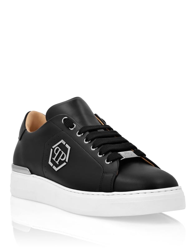 Elegant uniqueness for your free time with these leather lo-top sneakers. Look at the details.   Nappa upper   Perforated elements   Matching colored laces   Nickel plated logo on the outer quarter   Nickel-plated metal heel stabilizer   Grooved outsole for maximum grip   Inner lining and removable insole
