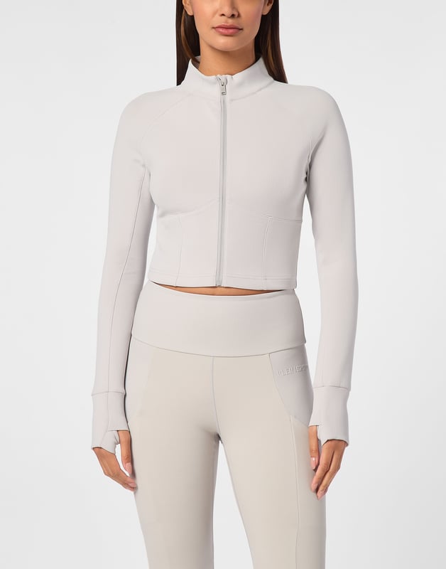 Check out the new jogging jacket making your sports sessions and leisure time stand out.   Stretch technic fleece fabric    Decorative stitching   Zip fastener on jacket   Sleeves with thumbholes