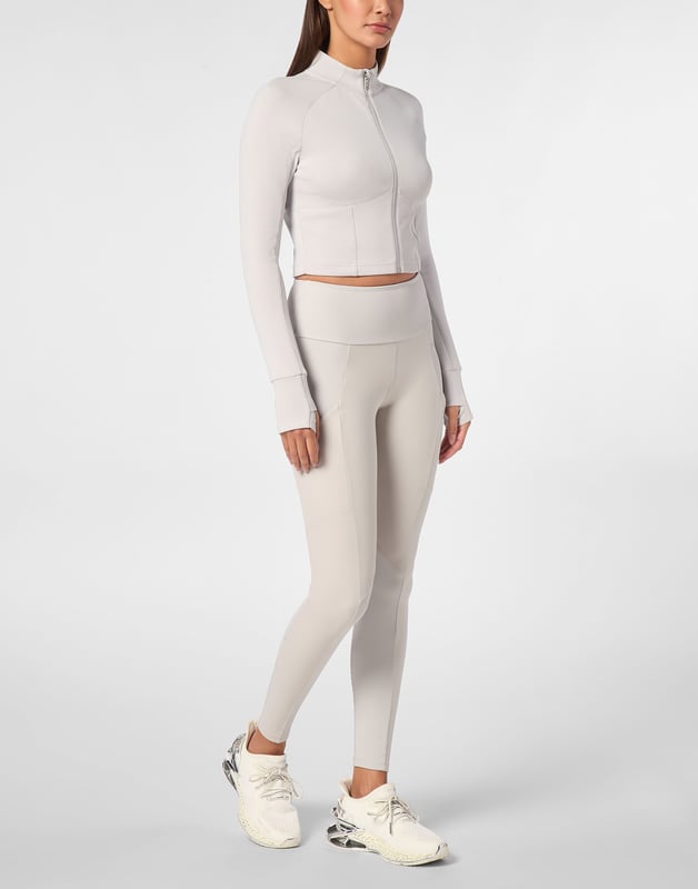 Check out the new jogging jacket making your sports sessions and leisure time stand out.   Stretch technic fleece fabric    Decorative stitching   Zip fastener on jacket   Sleeves with thumbholes