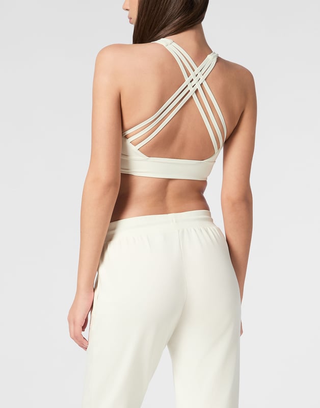 Comfortable and light-weight top designed to help you push your limits.   Maximum comfort and quick dry Lycra®   Triple crisscross straps   Support especially designed for cycling or gym training   Bottom hem grants support and firmness