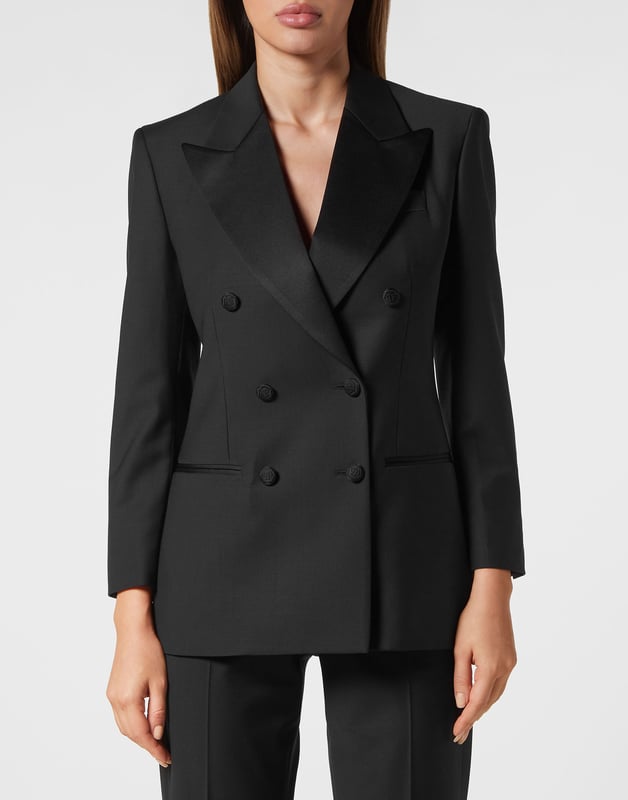 This light wool double brest blazer is a tale of refined elegance. See the care for details.    Light wool   Shiny satin peak lapels   Double breasted with lined buttons with embroidered Logo   Two slit pockets    Back slit    Inner lining   Fit Loose