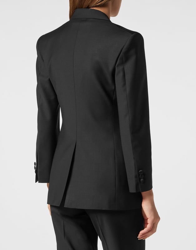 This light wool double brest blazer is a tale of refined elegance. See the care for details.    Light wool   Shiny satin peak lapels   Double breasted with lined buttons with embroidered Logo   Two slit pockets    Back slit    Inner lining   Fit Loose