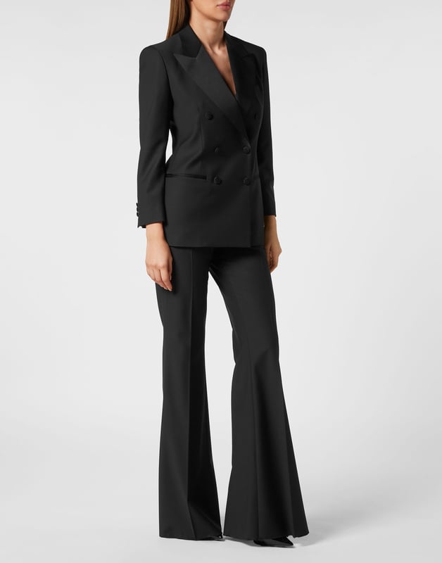 This light wool double brest blazer is a tale of refined elegance. See the care for details.    Light wool   Shiny satin peak lapels   Double breasted with lined buttons with embroidered Logo   Two slit pockets    Back slit    Inner lining   Fit Loose