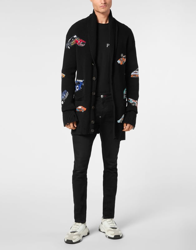 Innovation and creativity are the roots of the style of Plein. Discover the features of this cotton knit cardigan.   5-gauge knit cotton   Embroidered patches sewn all over   Shawl collar    Logoed patch   Buttons fastening    Two patch pockets   Rib knit, raw cut hems