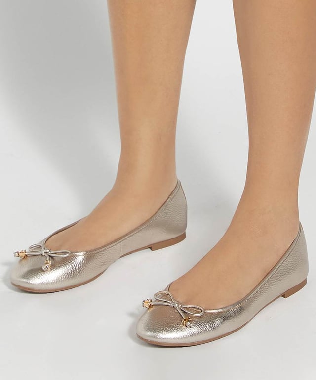 Dune Ladies Hallo - Charm-Detail Ballet Shoes Our own take on a signature style our Hallo ballet flats boast a feminine bow that's enhanced with our bespoke charm detailing. Designed with a quilted comfort sole for comfort with every step, this round-toed silhouette pairs perfectly with everything from denim to dresses alike.