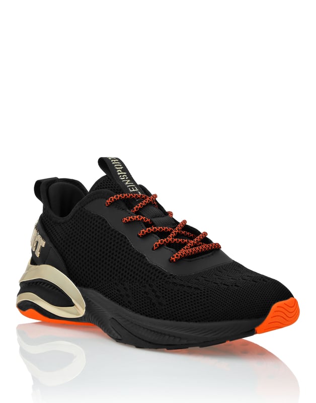 Runner Sneaker Ps These unisex runners are born from the creativity of the Plein Sport Lab aiming at conjugating cutting-edge technology and a unique and outstanding design. Jacquard woven mesh, dynamic and reinforced upper, for total protection Wrap-around structure for a stable and comfortable fit Nickel plated Logo on a strap on heel counter Tubular laces Tiger patch sewn on the tongue Shock-absorbing, ultra light-weight, ergonomic, high-tech rubber midsole Grooved outsole for an optimal grip Inner lining