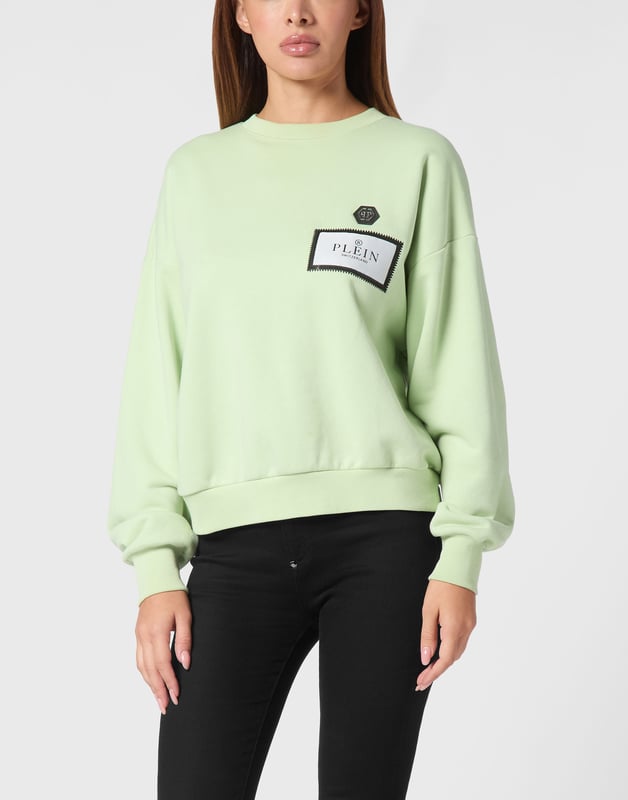 Define your style with a dash of personality. Check out this fleece crewneck with distinctive details.   Soft cotton fleece   Logoed label sewn at left chest   Logoed badge sewn at left chest   Rib knit hems   Fit: Over
