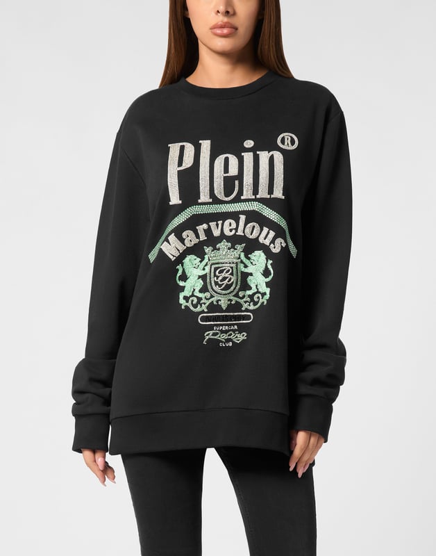 Define your style with a dash of personality. Check out this fleece sweatshirt with distinctive details.   Soft cotton fleece   Rhinestones application   Logoed patch sewn at back   Rib knit hems   Fit: Oversize