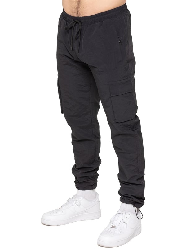 Stay ready for anything with the Enzo Milano Men’s Cargo Pants. Made from lightweight, poly fabric, these straight-leg trousers feature a regular fit, elasticated waistband with adjustable drawstring, and drawstring hems for a custom fit. With two Velcro-fastened side cargo pockets and a back welt pocket, they offer secure, practical storage. Perfect for everyday wear, travel, or outdoor use, these men’s cargo pants combine comfort, function, and style.