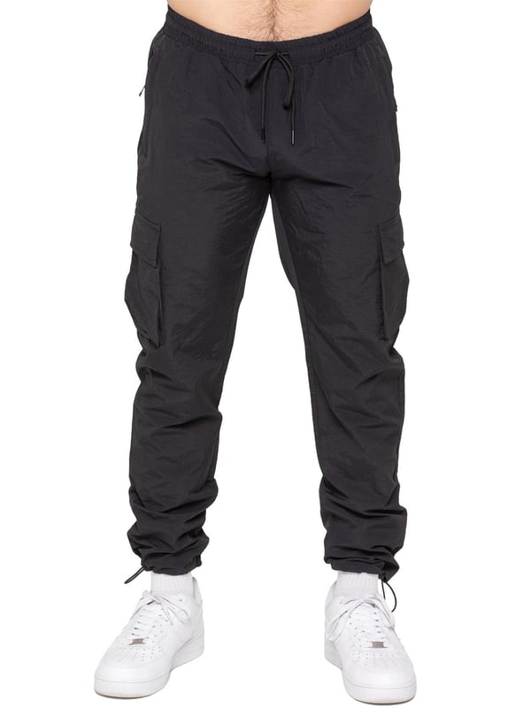 Stay ready for anything with the Enzo Milano Men’s Cargo Pants. Made from lightweight, poly fabric, these straight-leg trousers feature a regular fit, elasticated waistband with adjustable drawstring, and drawstring hems for a custom fit. With two Velcro-fastened side cargo pockets and a back welt pocket, they offer secure, practical storage. Perfect for everyday wear, travel, or outdoor use, these men’s cargo pants combine comfort, function, and style.