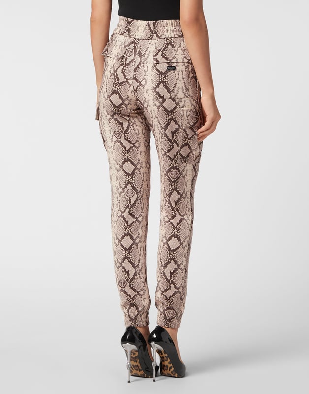 Dare to be edgy with these satin jogging-cut cargo trousers.   Python print satin   Two cargo pockets sewn at legs   Slit pockets   Logoed metal badge on the back   Waistband with stop-cord drawstring   Elasticated hems