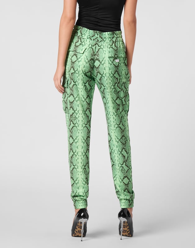 Dare to be edgy with these satin jogging-cut cargo trousers.   Python print satin   Two cargo pockets sewn at legs   Slit pockets   Logoed metal badge on the back   Waistband with stop-cord drawstring   Elasticated hems