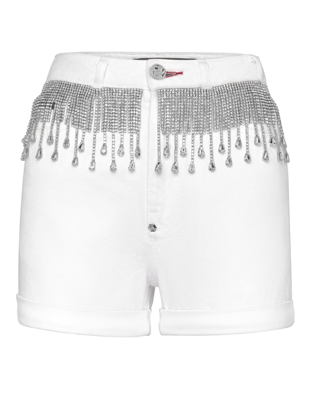 Los flecos biselados de cristales son la característica principal de este pantalón de 5 bolsillos de denim elástico con efecto desgastado. El icónico logotipo hexagonal está cosido en el bolsillo trasero derecho. Cierre con botón de joya de metal. Parte inferior vuelta hacia arriba.