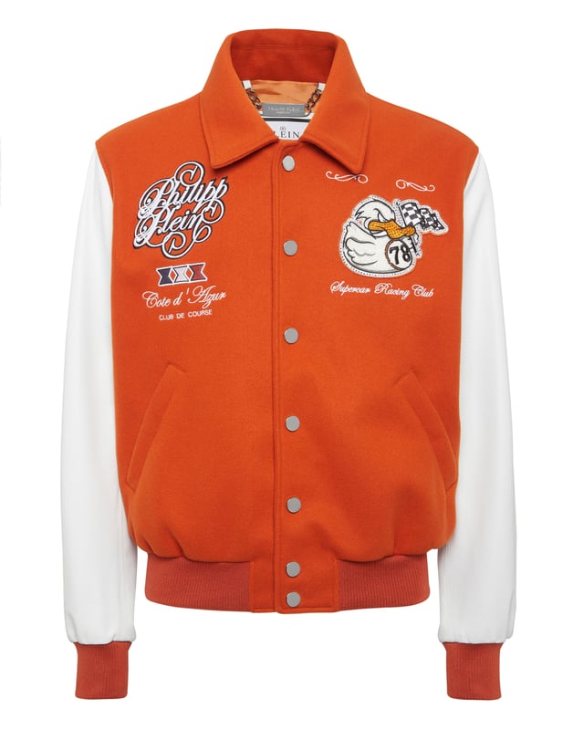 Add something unique and distinctive to your wardrobe. We suggest this varsity jacket.   Wool fabric   Leather   Embroidered patches sewn on the front and the back   Rhinestones applications   Embroidered details   Shirt collar   Snap buttons fastening   Two slit pockets   Rib knit tipping hems   Diamond quilted satin lining