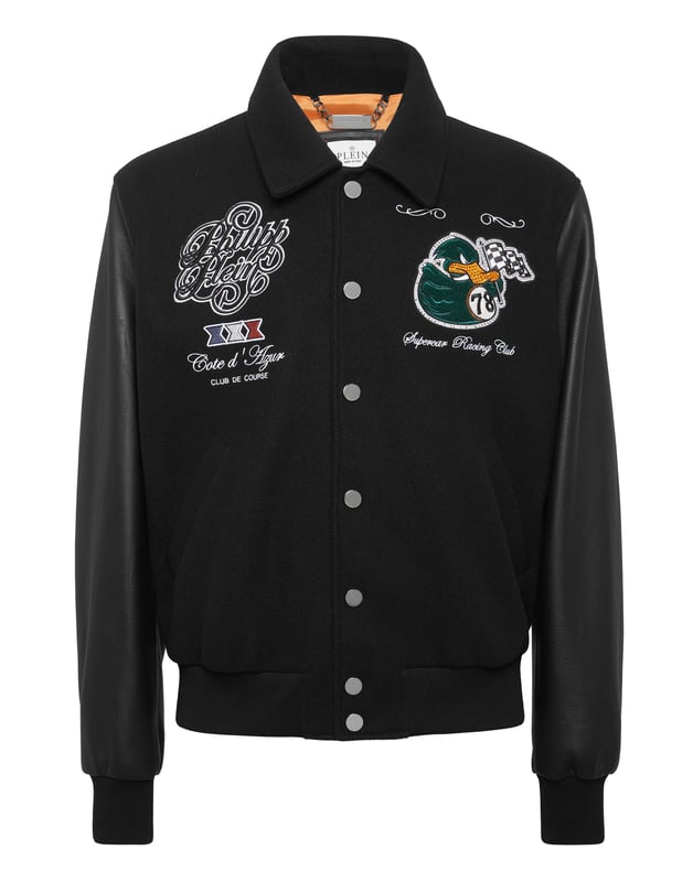 Add something unique and distinctive to your wardrobe. We suggest this varsity jacket.   Wool fabric   Leather   Embroidered patches sewn on the front and the back   Rhinestones applications   Embroidered details   Shirt collar   Snap buttons fastening   Two slit pockets   Rib knit tipping hems   Diamond quilted satin lining