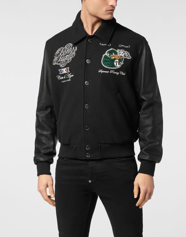 Add something unique and distinctive to your wardrobe. We suggest this varsity jacket.   Wool fabric   Leather   Embroidered patches sewn on the front and the back   Rhinestones applications   Embroidered details   Shirt collar   Snap buttons fastening   Two slit pockets   Rib knit tipping hems   Diamond quilted satin lining