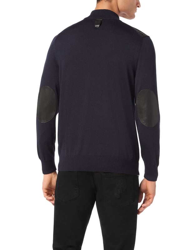 A touch of class for your leisure moments. See this merino wool and silk tracksuit with precious details.   Merino wool and silk    Leather appliqués and inserts   Monogram embroidered on top and bottom   Full zip top   Slit pockets on top and bottom   Stop-cord drawstring waistband   Rib knit hems