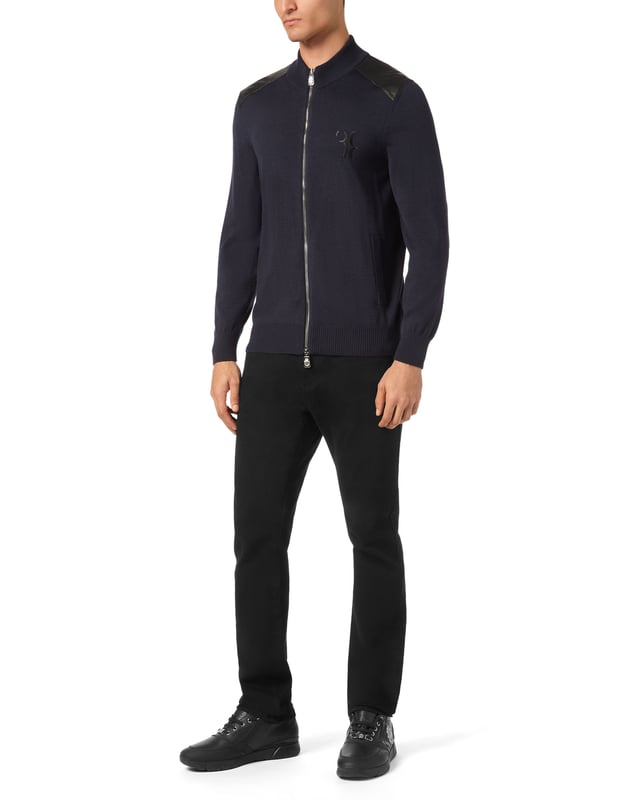 A touch of class for your leisure moments. See this merino wool and silk tracksuit with precious details.   Merino wool and silk    Leather appliqués and inserts   Monogram embroidered on top and bottom   Full zip top   Slit pockets on top and bottom   Stop-cord drawstring waistband   Rib knit hems