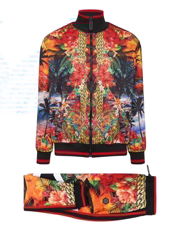 Choose to jog in style with the uniqueness identifying the style of Plein. We designed this techno fabric tracksuit featuring a Hawaii-themed print throughout.   Hawaii-inspired print triacetate   Contrasting sidebands on sleeves and outseam   Zip-up sweatjacket with PP Hexagon on a saffian leather patch sewn at left chest   Two slit pockets   PP Hexagon on a saffian leather badge sewn on the left side of pants   Slit pockets   Waistband with stop-cord drawstring   Rib knit hems