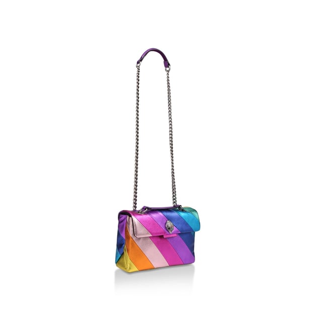 Kurt Geiger London Leather Leather Kensington Bag The Leather Kensington Bag is crafted from soft metallic laminated pebble grain cow leather with iconic rainbow sewn stripe pattern. The antiqued silver Eagle head features rainbow coloured crystals and black crystal eyes on the front flap. 17cm (H), 26cm (L), 8cm (D). Strap drop cross body: 111cm. Strap drop shoulder: 64cm.