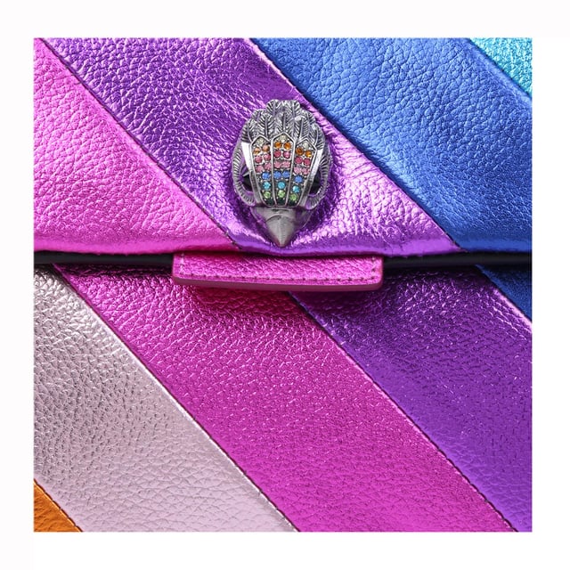 Kurt Geiger London Leather Leather Kensington Bag The Leather Kensington Bag is crafted from soft metallic laminated pebble grain cow leather with iconic rainbow sewn stripe pattern. The antiqued silver Eagle head features rainbow coloured crystals and black crystal eyes on the front flap. 17cm (H), 26cm (L), 8cm (D). Strap drop cross body: 111cm. Strap drop shoulder: 64cm.