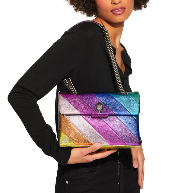 Kurt Geiger London Leather Leather Kensington Bag The Leather Kensington Bag is crafted from soft metallic laminated pebble grain cow leather with iconic rainbow sewn stripe pattern. The antiqued silver Eagle head features rainbow coloured crystals and black crystal eyes on the front flap. 17cm (H), 26cm (L), 8cm (D). Strap drop cross body: 111cm. Strap drop shoulder: 64cm.