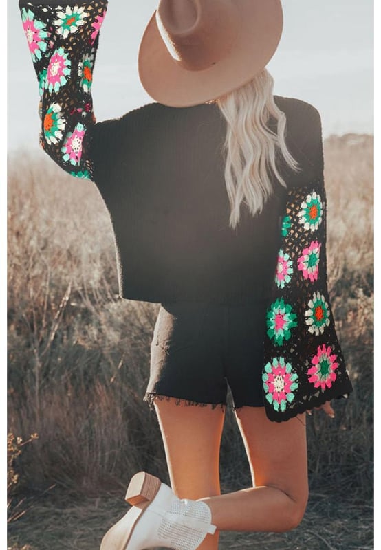Black floral crochet bell sleeve loose sweater
  Made with high
  quality materials
  Relaxed fit
  Intricate floral crochet detailing
  Trendy bell sleeves
  Versatile piece that can be dressed up or down
  Suitable for any occasion