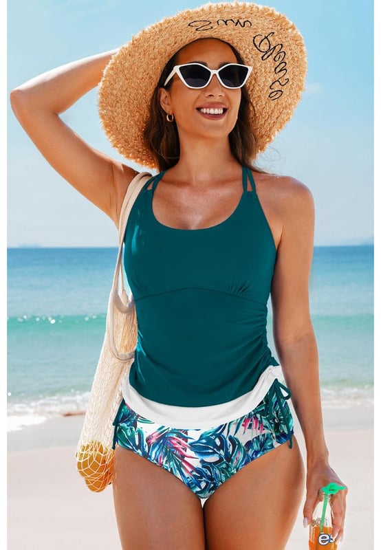 Our styles are designed with a trendy fitted look in mind following an international size standard. For the best fit we suggest choosing one size up from your usual. Be sure to check our sizing chart to find your perfect match!
  Color block design for the tankini top
  Strappy back and drawstring sides
  Matching floral print swim shorts
  Available in various colors and sizes
Material: 82% Polyamide 18% Elastane