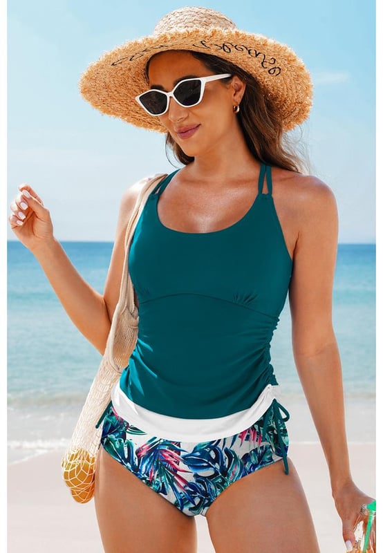 Our styles are designed with a trendy fitted look in mind following an international size standard. For the best fit we suggest choosing one size up from your usual. Be sure to check our sizing chart to find your perfect match!
  Color block design for the tankini top
  Strappy back and drawstring sides
  Matching floral print swim shorts
  Available in various colors and sizes
Material: 82% Polyamide 18% Elastane