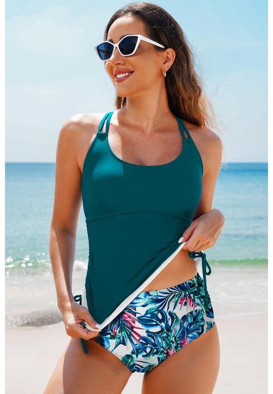 Our styles are designed with a trendy fitted look in mind following an international size standard. For the best fit we suggest choosing one size up from your usual. Be sure to check our sizing chart to find your perfect match!
  Color block design for the tankini top
  Strappy back and drawstring sides
  Matching floral print swim shorts
  Available in various colors and sizes
Material: 82% Polyamide 18% Elastane
