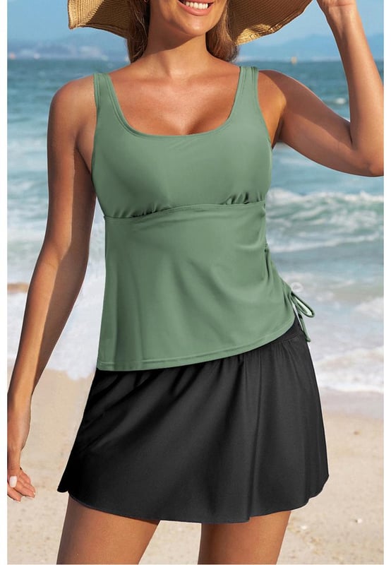 Our styles are designed with a trendy fitted look in mind following an international size standard. For the best fit we suggest choosing one size up from your usual. Be sure to check our sizing chart to find your perfect match!
  Mist Green Scoop Neck Adjustable Tankini and Matching Skort Bathing Suit
  2
  piece set: tankini top and skort bottom
  Padded cups for added support
  Adjustable straps for a customized fit
  Drawstring at the side for adjustable coverage
  Matching skort bottom with attached panties
  Available in solid color sets or mix
  and
  match styles
  High elasticity for a comfortable fit
Material: 82% Polyamide 18% Elastane