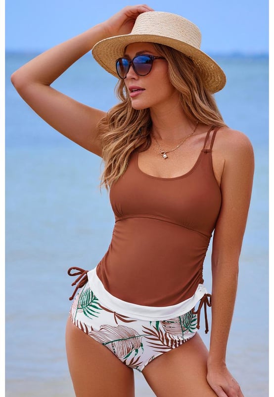 Our styles are designed with a trendy fitted look in mind following an international size standard. For the best fit we suggest choosing one size up from your usual. Be sure to check our sizing chart to find your perfect match!
  Color block design for the tankini top
  Strappy back and drawstring sides
  Matching floral print swim shorts
  Available in multiple colors and sizes
  High elasticity for a comfortable fit
Material: 82% Polyamide 18% Elastane