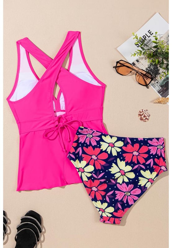 Our styles are designed with a trendy fitted look in mind following an international size standard. For the best fit we suggest choosing one size up from your usual. Be sure to check our sizing chart to find your perfect match!
  Floral tankini set for a fun and feminine look
  Flattering V
  neckline for added elegance
  Trendy crisscross back design for style and support
  Ruffled hem on the bottom for a playful touch
  Two
  piece set for versatile beach fashion
Material: 82% Polyamide 18% Elastane
