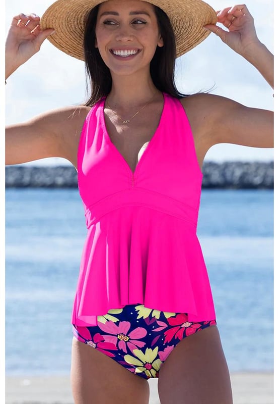Our styles are designed with a trendy fitted look in mind following an international size standard. For the best fit we suggest choosing one size up from your usual. Be sure to check our sizing chart to find your perfect match!
  Floral tankini set for a fun and feminine look
  Flattering V
  neckline for added elegance
  Trendy crisscross back design for style and support
  Ruffled hem on the bottom for a playful touch
  Two
  piece set for versatile beach fashion
Material: 82% Polyamide 18% Elastane