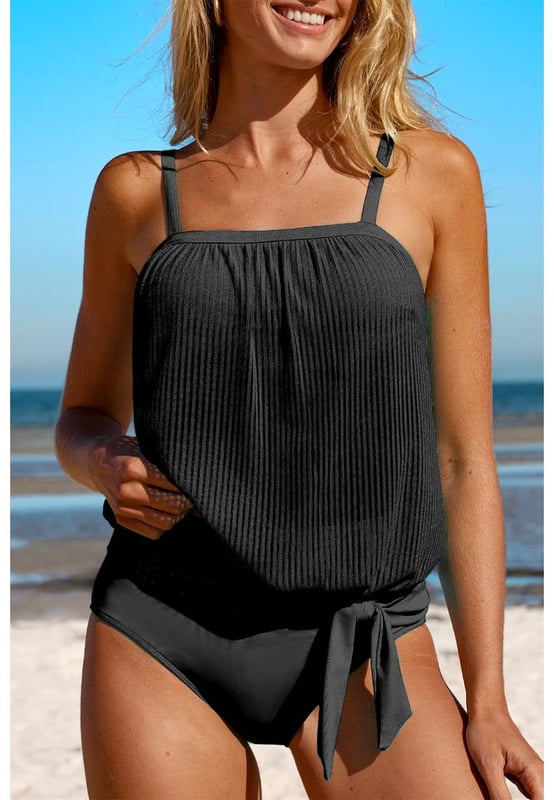 Trendy Black Striped Mesh Knotted Hem Tankini Swimsuit
  High
  rise design for easy wear
  Adjustable straps and removable padded cups for customizable support
  Versatile and functional for any beach or pool day
  Available in sizes S to 2XL with high elasticity
  Refer to the size chart for accurate sizing
Material: 82% Polyamide 18% Elastane